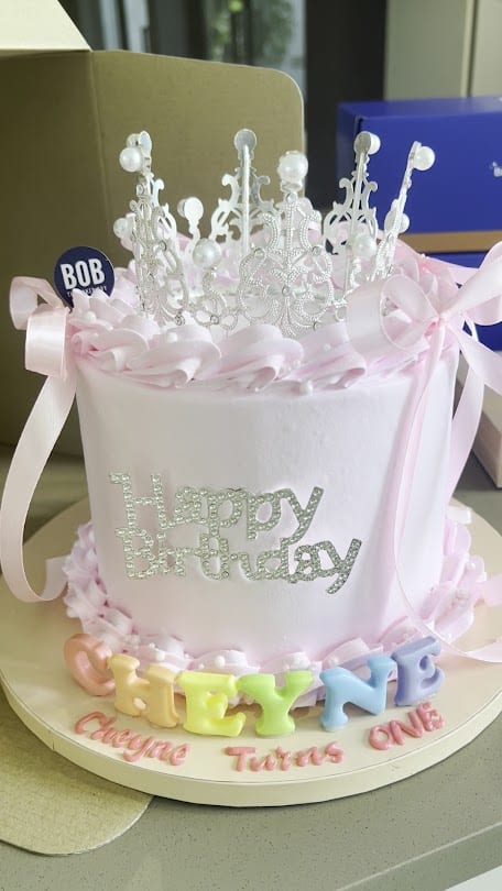 White Happy Birthday cake with pink piping from Bob the Baker Boy