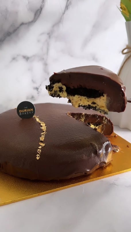 The Durian Bakery chocolate fudge cake cut to show its Mao Shan Wang core
