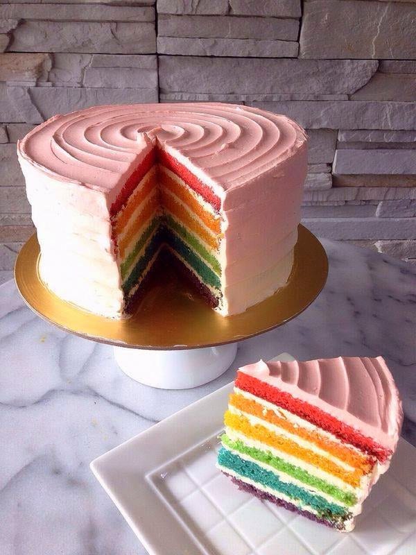 The White Ombre rainbow layer cake cut to show its layers