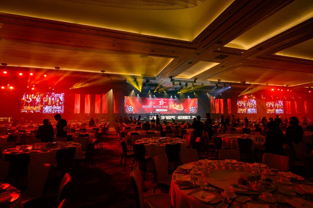 A company dinner and dance in a hotel ballroom by JNR Event