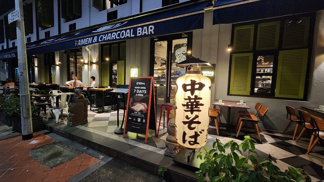 Torasho Ramen & Charcoal Bar storefront at night, Tras Street